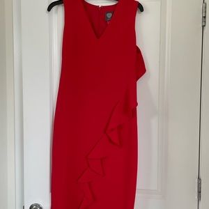 Never worn bright red stand out dress with one shoulder ruffle detail.